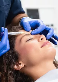 a patient having an injection on her forehead