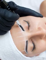 microblading eyebrows of a woman
