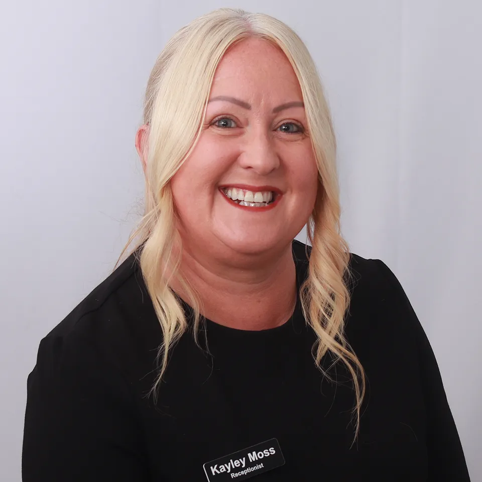 Kayley Moss, smiling receptionist with blonde hair