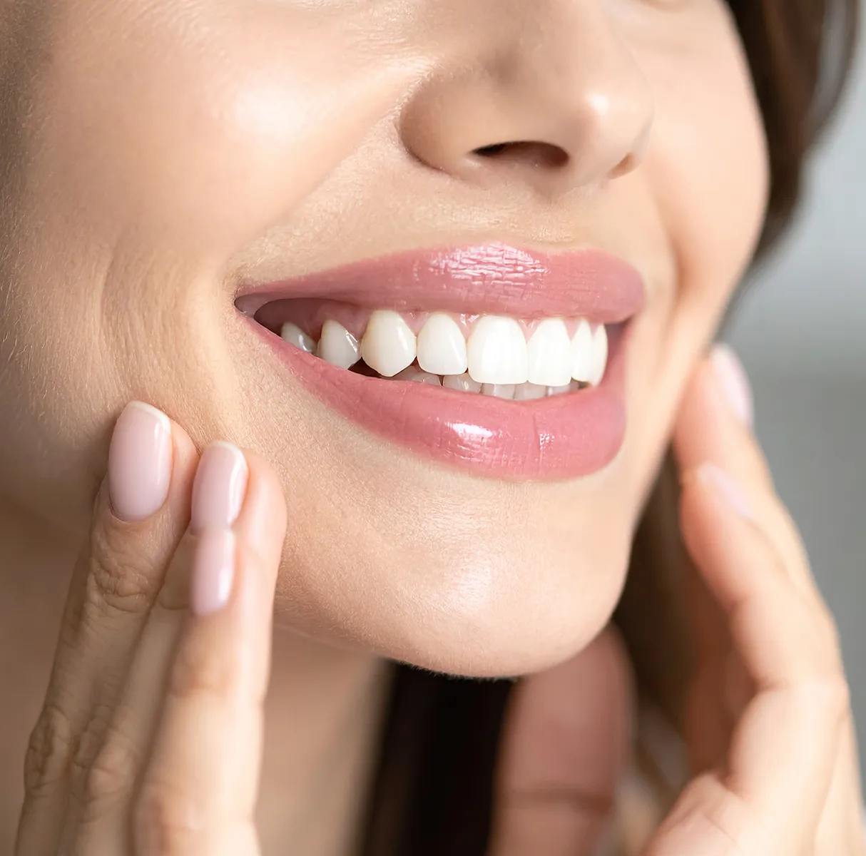 Woman smiling with bright white teeth and pink lips